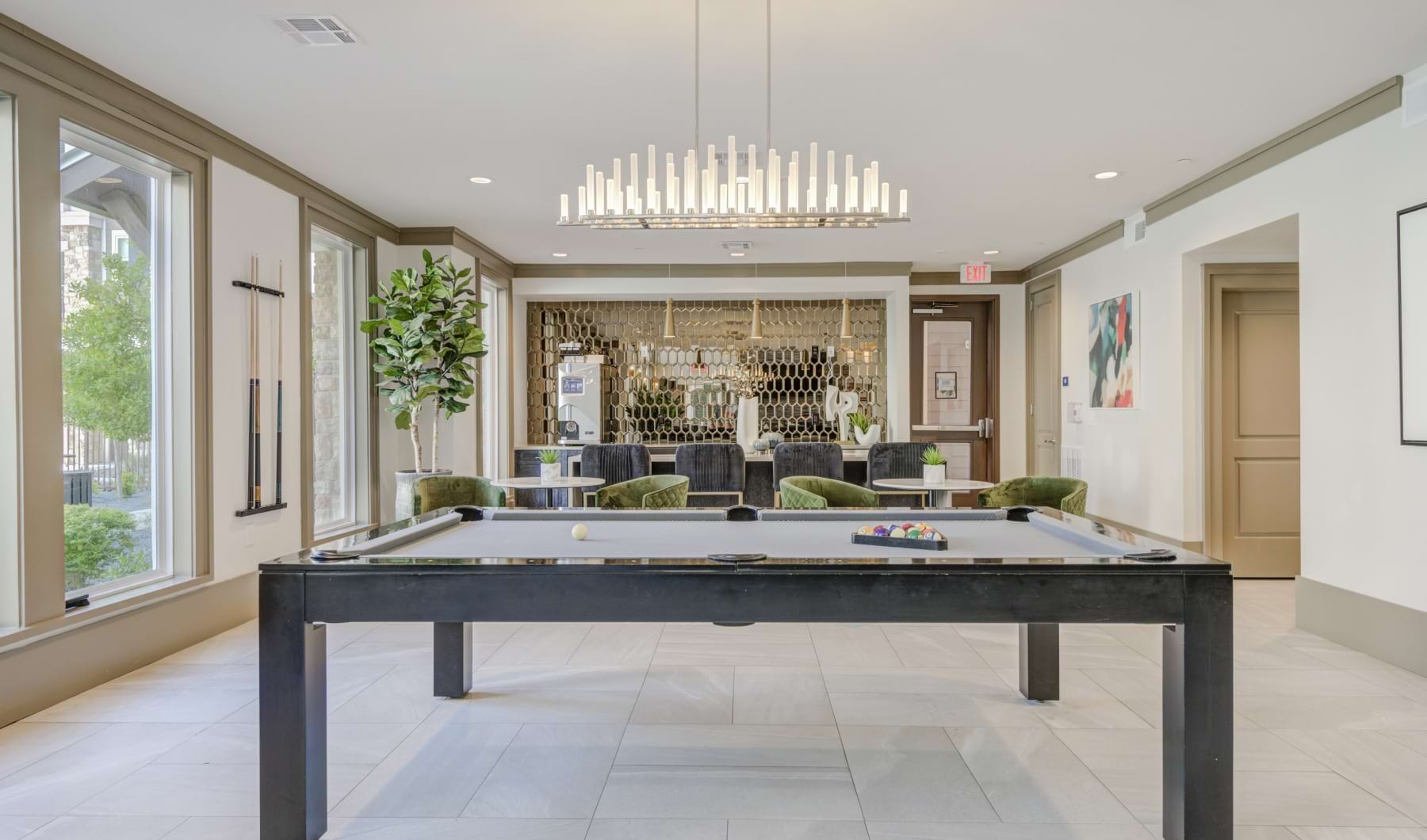 Entertainment room and lounge at our apartments in Allen, TX, featuring a billiard table and tiled floors. Entertainment room and lounge at our apartments in Allen, TX, featuring a billiard table and tiled floors.