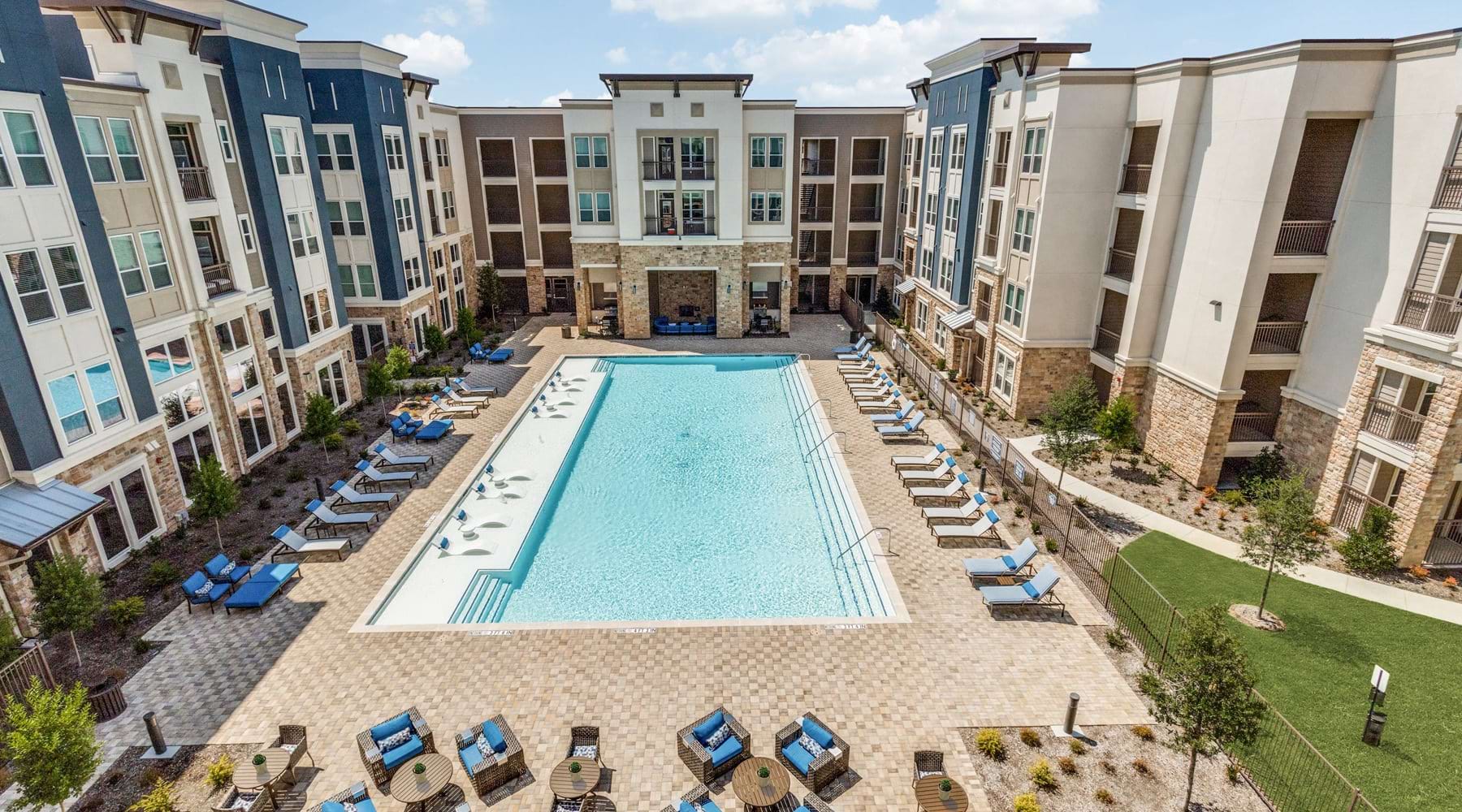 Pool Large pool with shaded seating and clubhouse access.